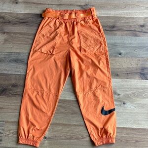Nike Orange Track Pants with Black Swoosh